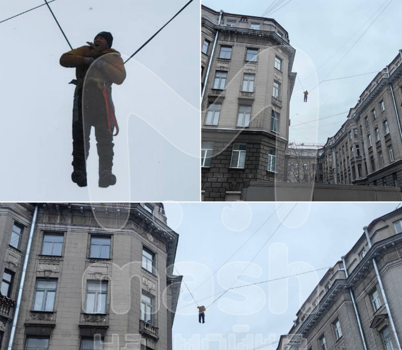В Питере дворник, работавший без страховки, сорвался с крыши и повис на проводах. Фото: t.me/mashmoyka